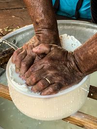 Cropped hands of man preparing food