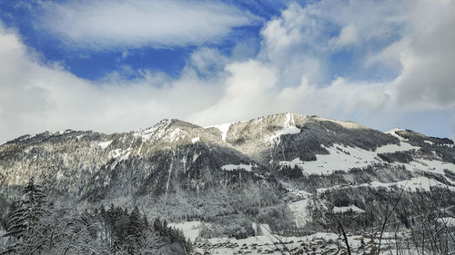 Snow covered mountain against sky