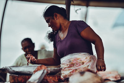 Young woman preparing food