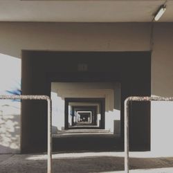 Empty alley along buildings