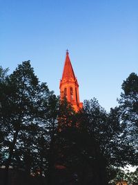 Low angle view of church against blue sky