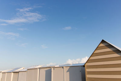 Low angle view of building against blue sky