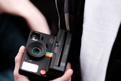 Close-up of hand holding camera