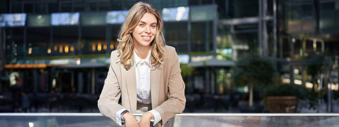 Young woman standing in city