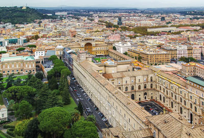 High angle view of buildings and trees in city