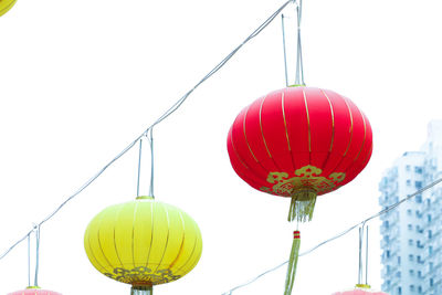 Low angle view of lantern against clear sky