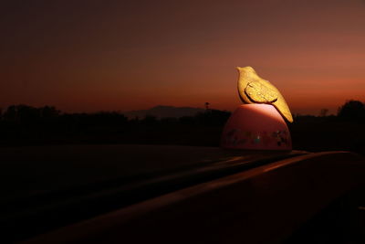 Close-up of silhouette car against sky during sunset