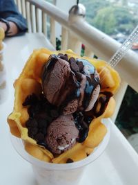 Close-up of hand holding ice cream