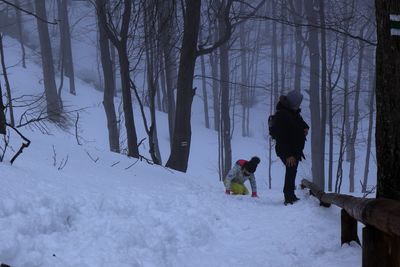 People on snow covered land