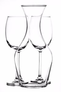 Close-up of wineglass on table against white background