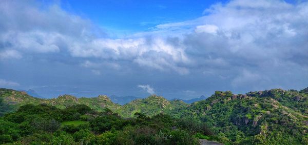 Scenic view of tree mountains against sky