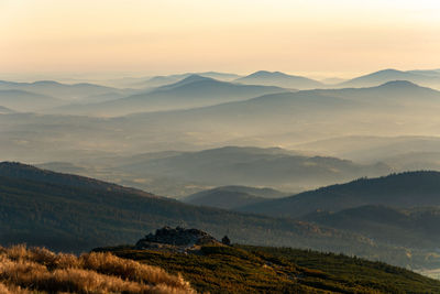 Scenic view of mountains against sky during sunset