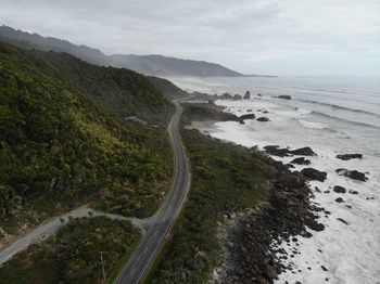 High angle view of road by sea against sky