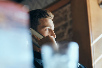 Portrait of a serious young man looking away