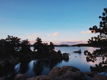 Scenic view of silhouette mountains against sky at sunset