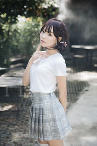 Portrait of teenage girl standing outdoors