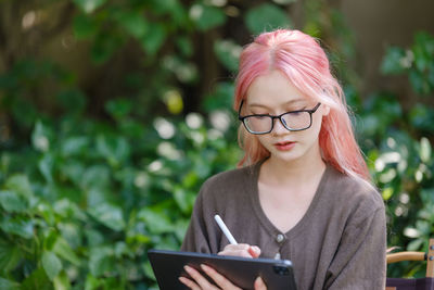 Young woman using mobile phone