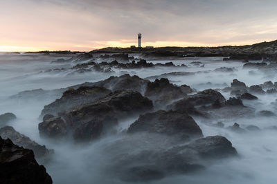 Scenic view of sea against sky during sunset
