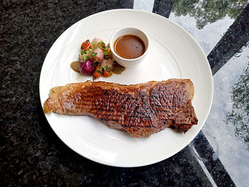 High angle view of wagyu beef in plate on table