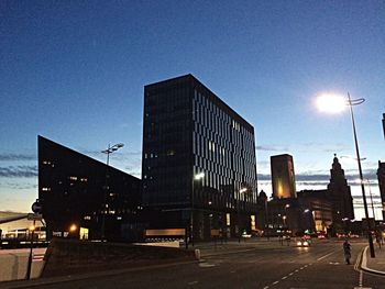 Low angle view of buildings against blue sky