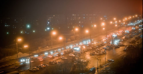 High angle view of illuminated city at night