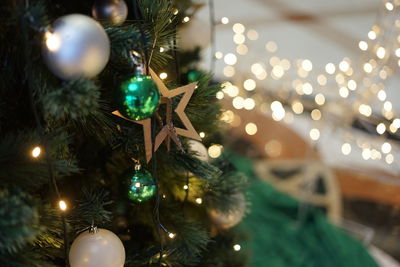 Close-up of illuminated christmas tree at night