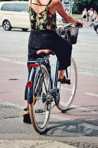 Man riding bicycle on road