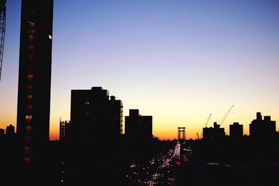 Silhouette of city at sunset