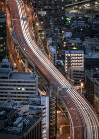 High angle view of illuminated cityscape at night