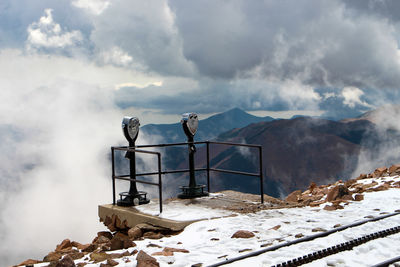 Scenic view of snow covered mountains against sky