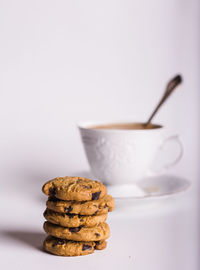 Close-up of cookies on table against white background
