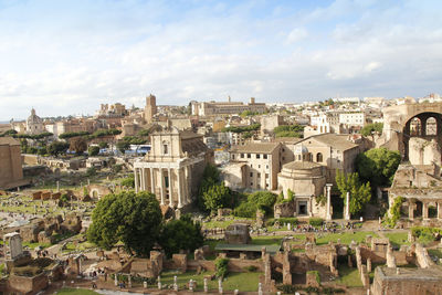 Aerial panoramic cityscape view of the roman forum during sunset in rome, italy