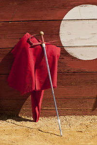 High angle view of red umbrella on wooden table