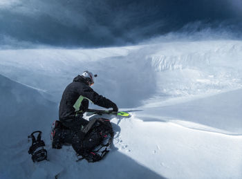 High angle view of people on snowcapped mountain during winter