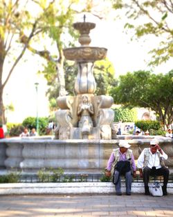 Statue of fountain against trees