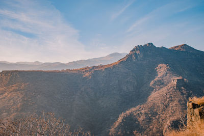 Panoramic view of mountain range against sky