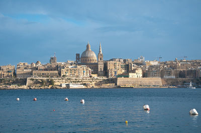 View of buildings in city at waterfront