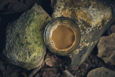 High angle view of drink on rock