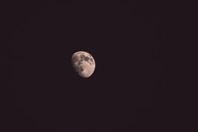 Low angle view of moon against sky at night