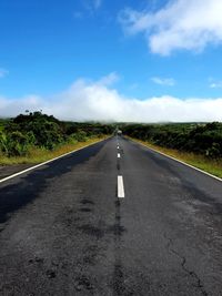 Empty road against sky