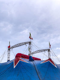 Low angle view of a circus tent against sky