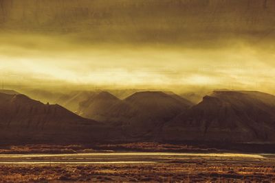 Scenic view of mountain against cloudy sky