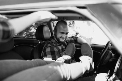 Portrait of man sitting in car