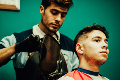 Barbershop teenager haircut