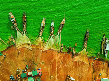 High angle view of sailboats moored in lake