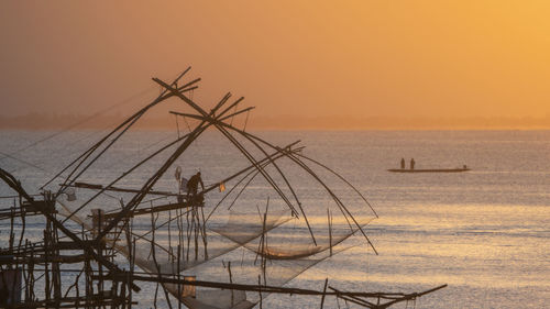 Scenic view of sea against clear sky during sunset