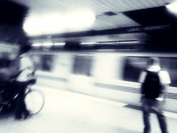 Blurred motion of people walking on road