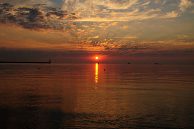 Scenic view of sea at sunset