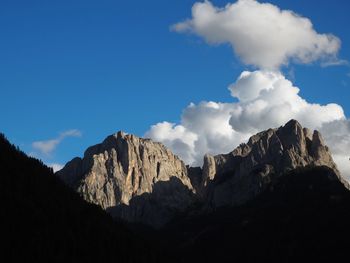 Scenic view of mountains against cloudy sky