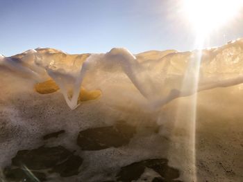 Close-up of snow against sky